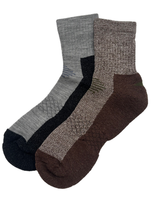 Three pairs of crew socks in earthy tones, including heather gray, charcoal black, taupe, and brown, arranged overlapping on a plain white background.