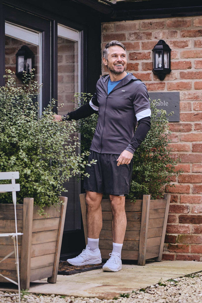 HJ Hall Bamboo Trainer Socks in White – editorial shot